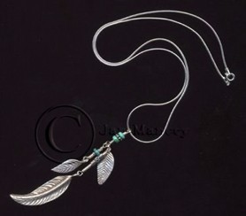 cluster pendant of Karen Hilltribe leaves, Bali sterling findings, and genuine turquoise "dangles"